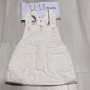 Toddler overall skirt with stitched in flowers. Excellent condition